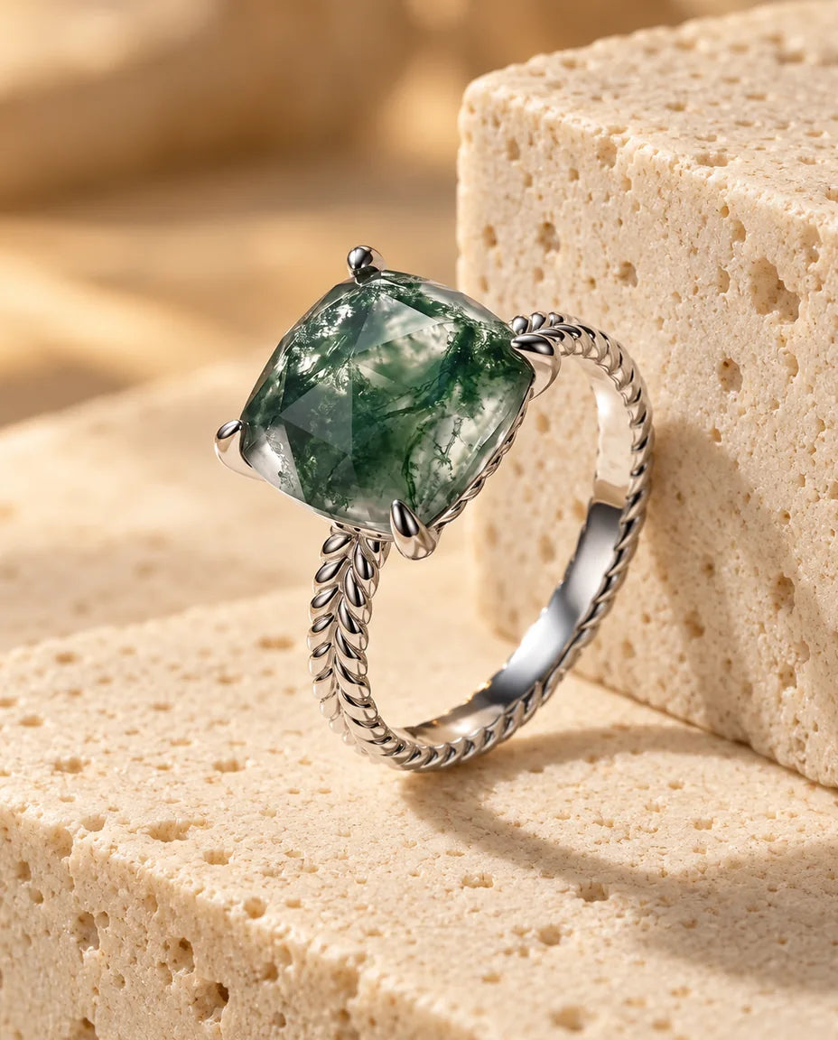Moss Agate Ring - displayed on a travertine block