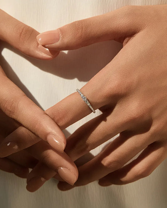 Graduated moissanite wedding band in 925 sterling silver with 19 round D colour stones