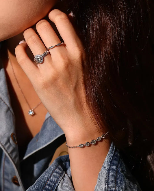 Moissanite Bezel Bracelet in 925 Sterling Silver - worn on the wrist, hand near her face
