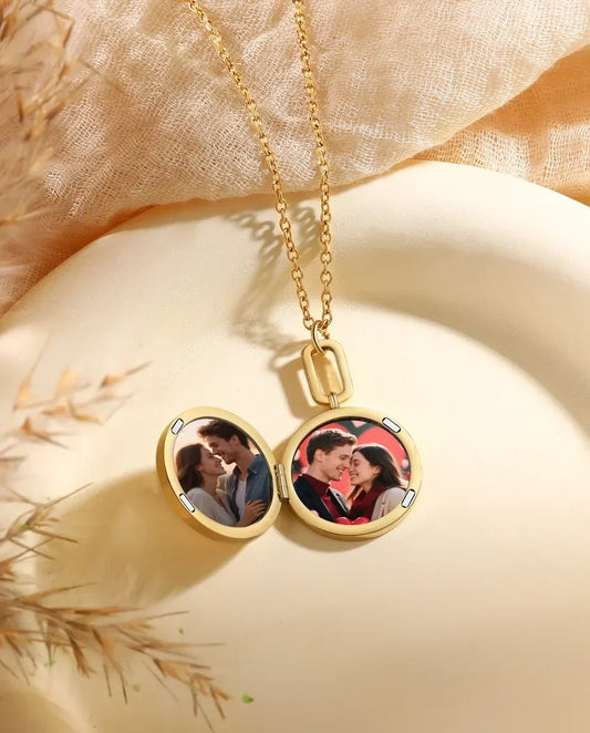 Round mother of pearl locket open showing two photos inside