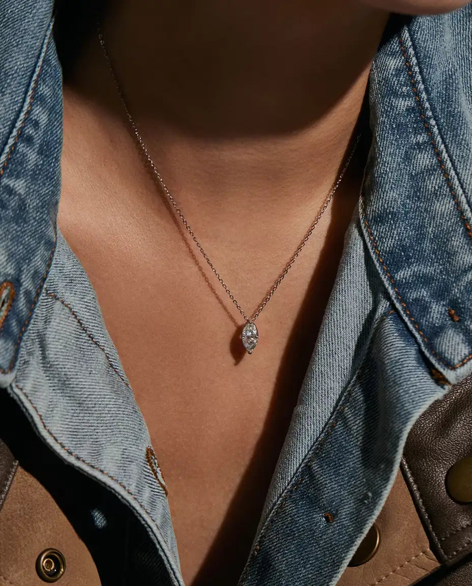 1 ct Marquise Moissanite Necklace in 925 Sterling Silver - worn on a model, close-up at the collarbone