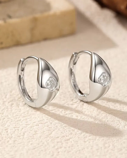 Asscher Cut Moissanite Huggie Hoop Earrings in 925 Sterling Silver - close-up of the Asscher cut moissanite in the polished dome