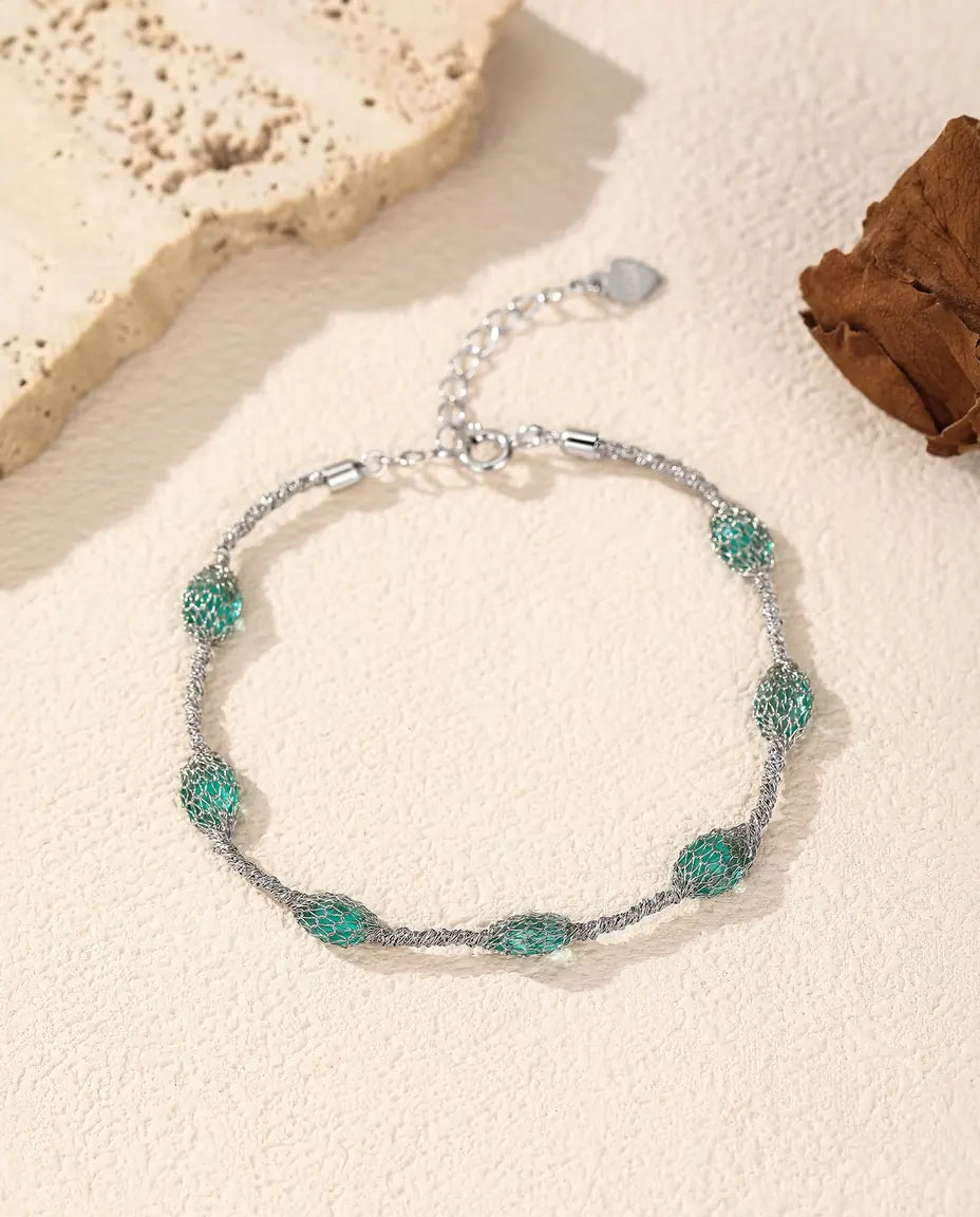 Caged Zircon Bracelet in 925 Sterling Silver - green zircon version, closer view of the wire mesh