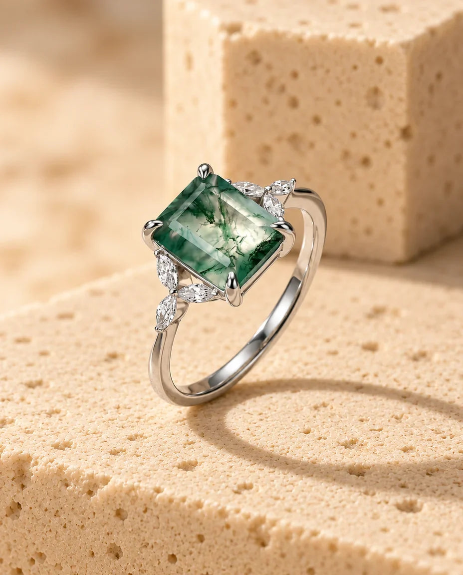 Moss Agate Ring - displayed on a travertine block