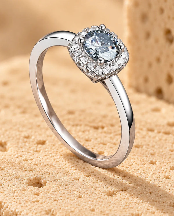 Moissanite Engagement Ring - displayed on a travertine block