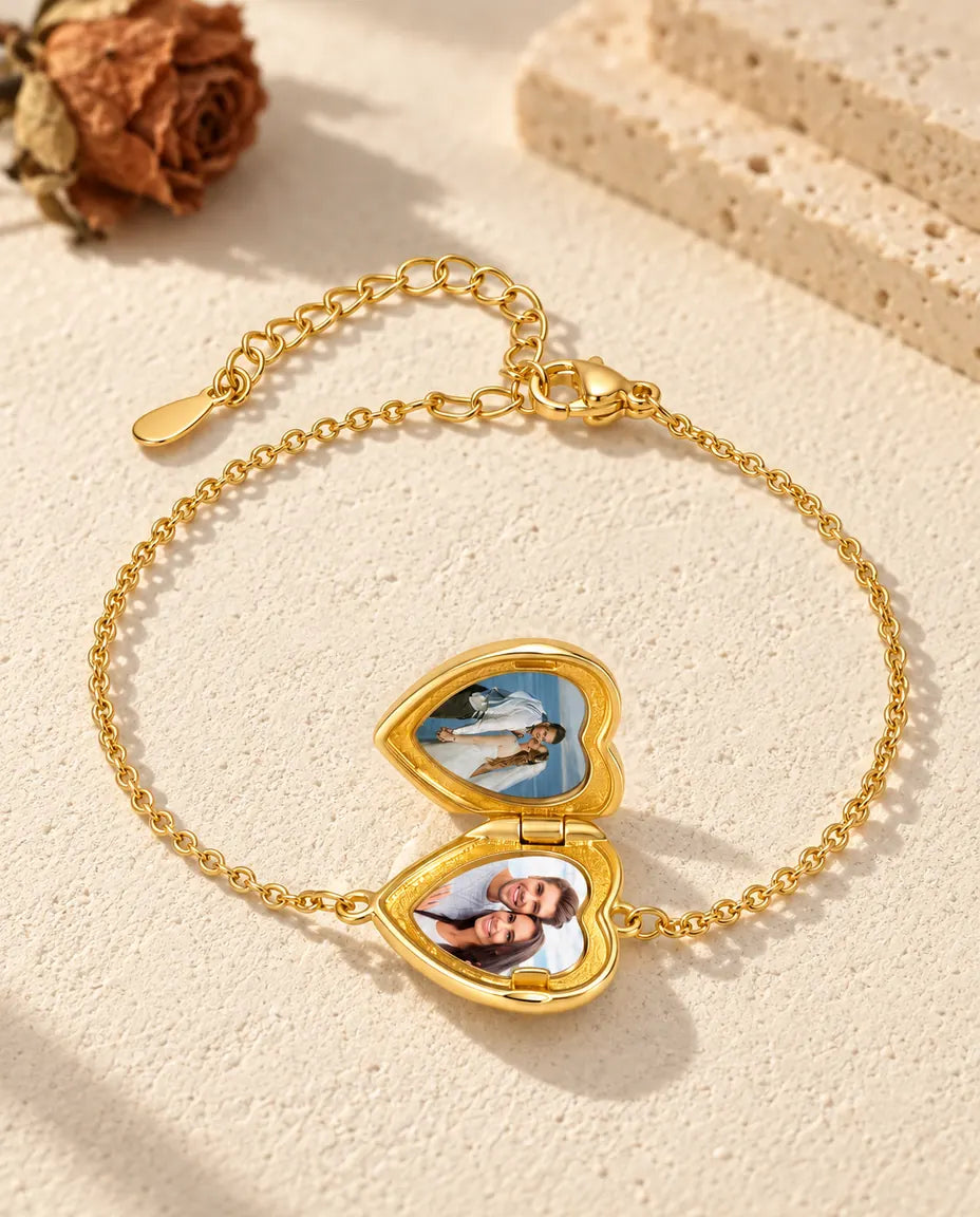 Heart locket bracelet open, with two photos inside