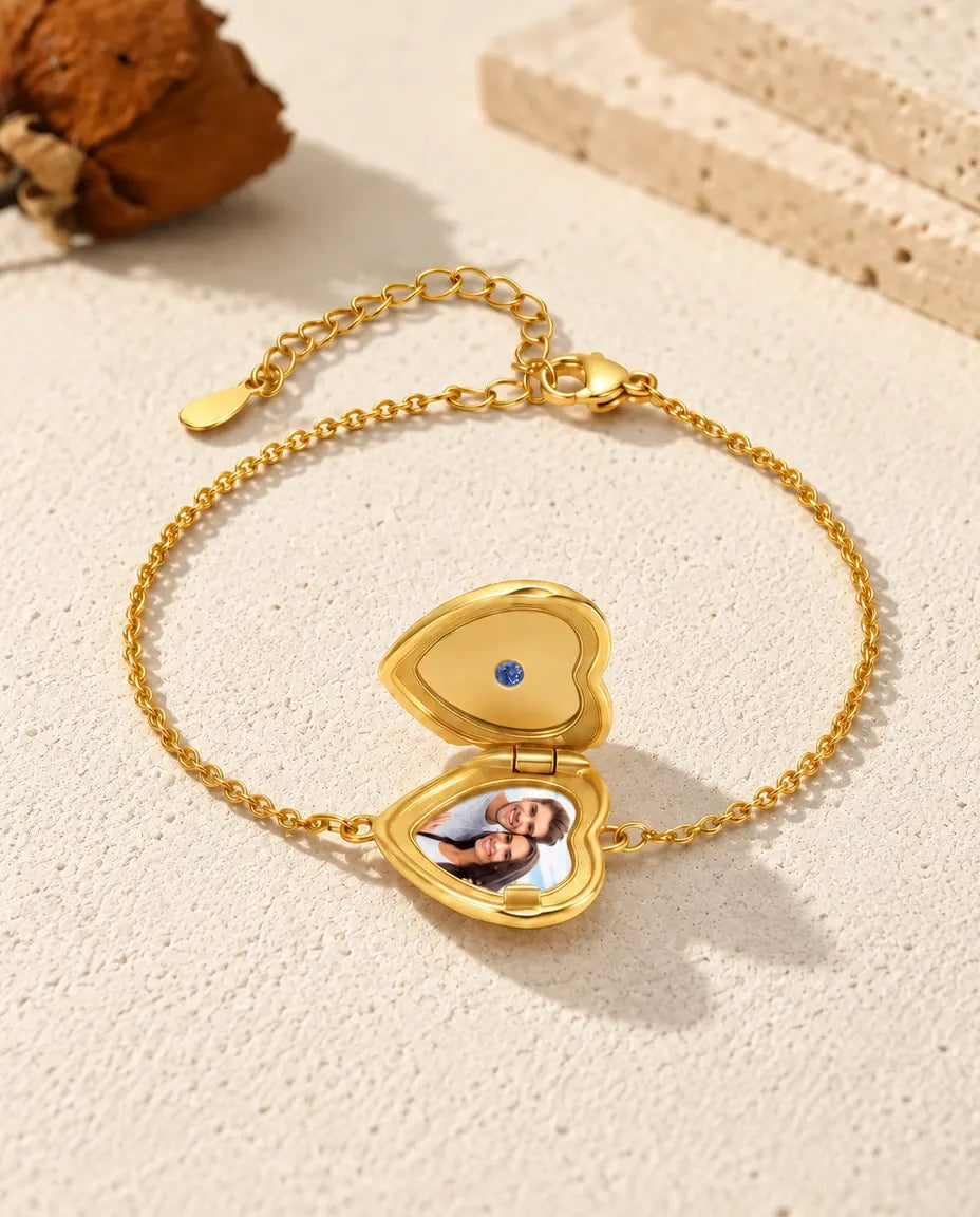 Open heart locket bracelet with one photo, seen from a low angle
