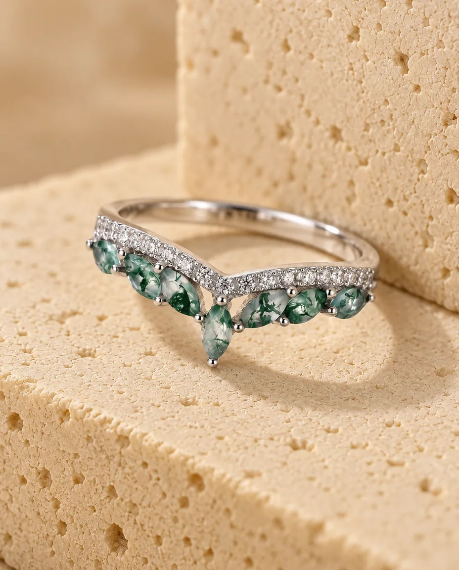 Moss Agate Ring - displayed on a travertine block