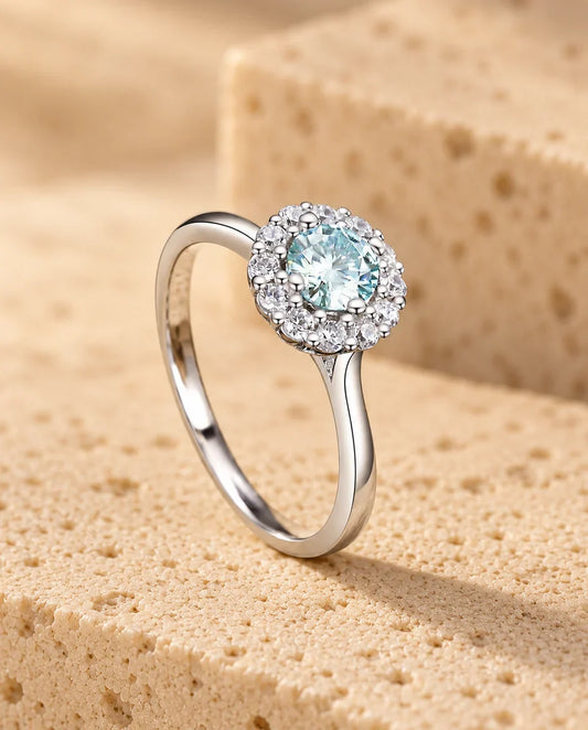 Moissanite Halo Ring - displayed on a travertine block