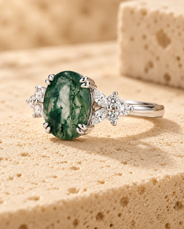 Moss Agate Ring - displayed on a travertine block