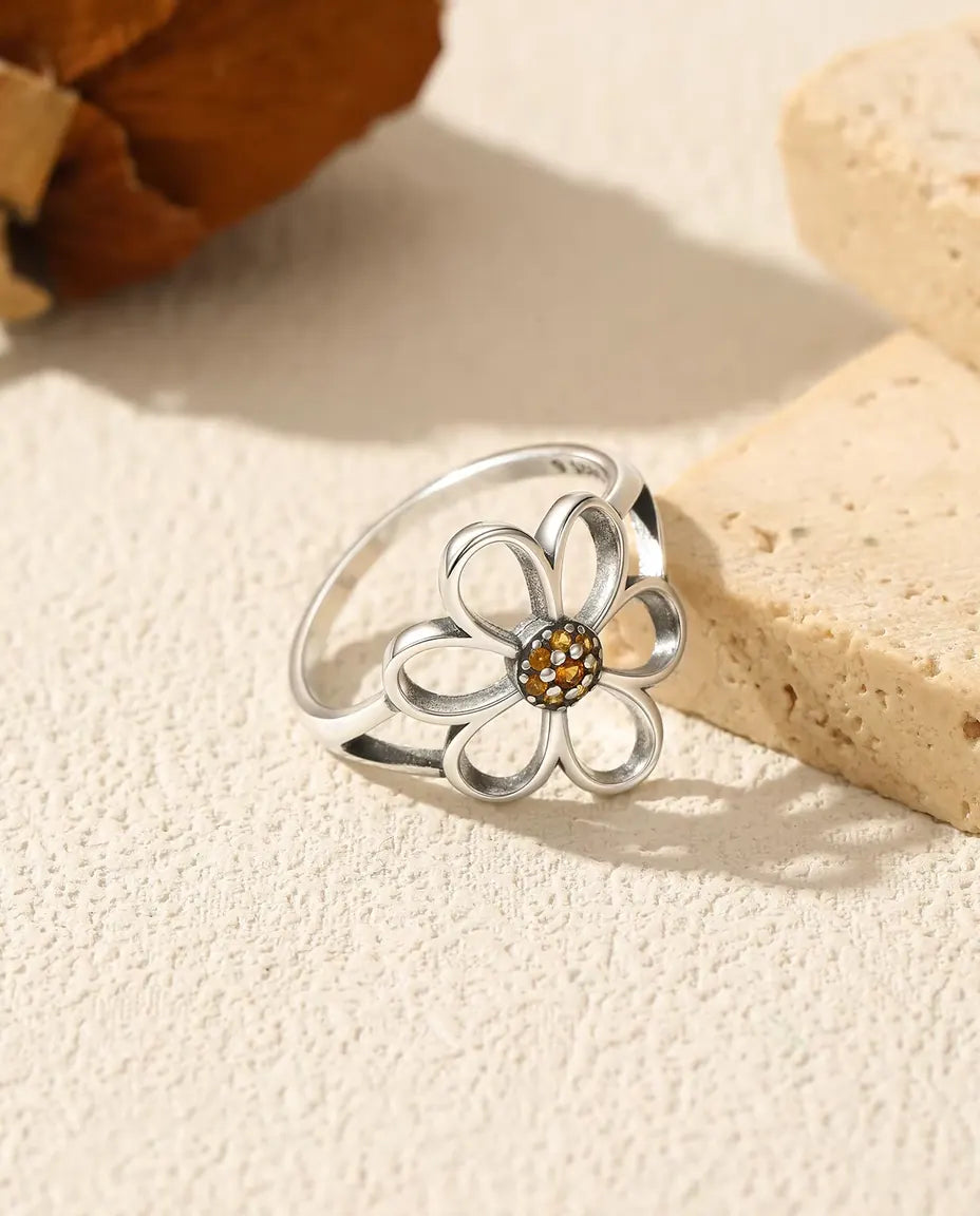 Open flower ring with orange zirconia centre in 925 silver