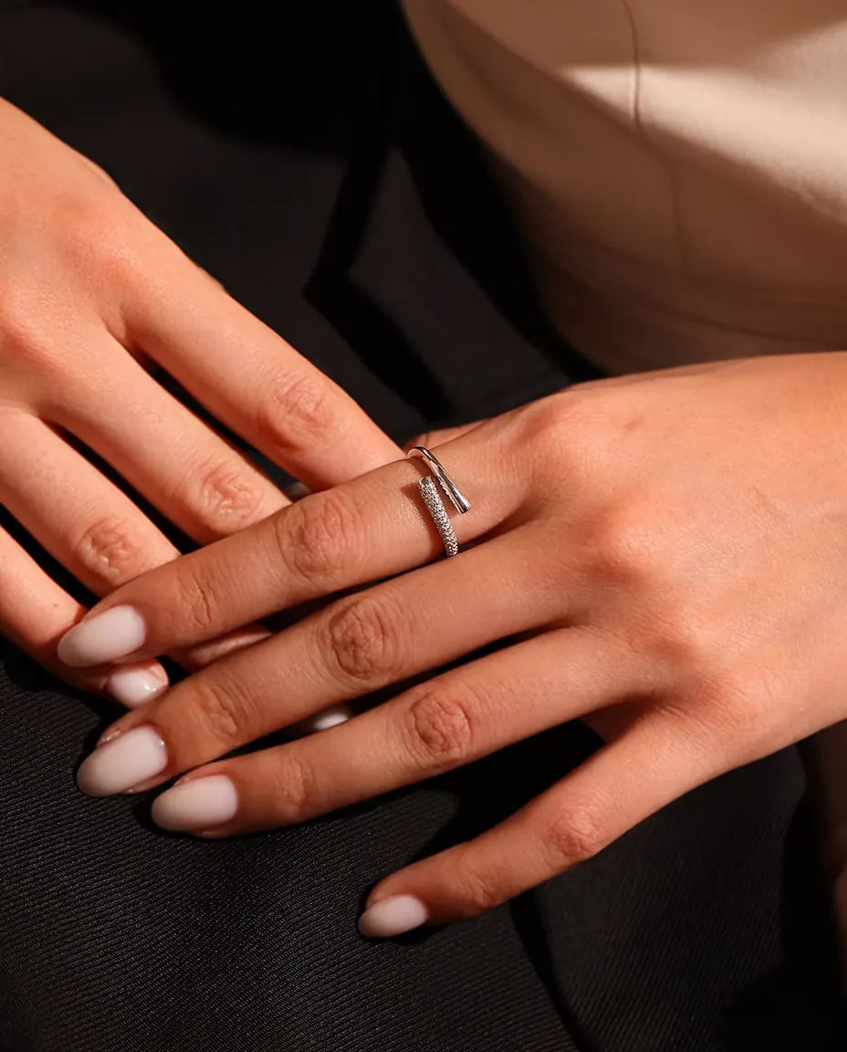 Pave Moissanite Bypass Ring in 925 Sterling Silver - worn on a model’s hand