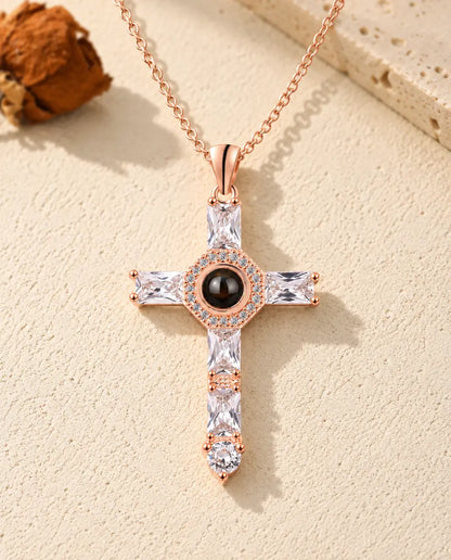 Front view of the rose gold tone cross with baguette cubic zirconia arms