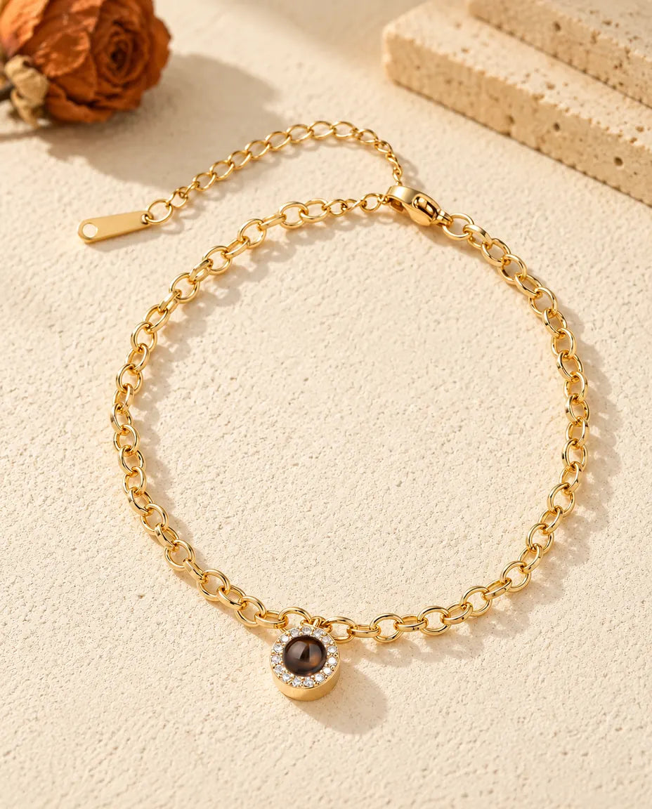 Top view of the gold tone pave circle projection bracelet with its extender chain