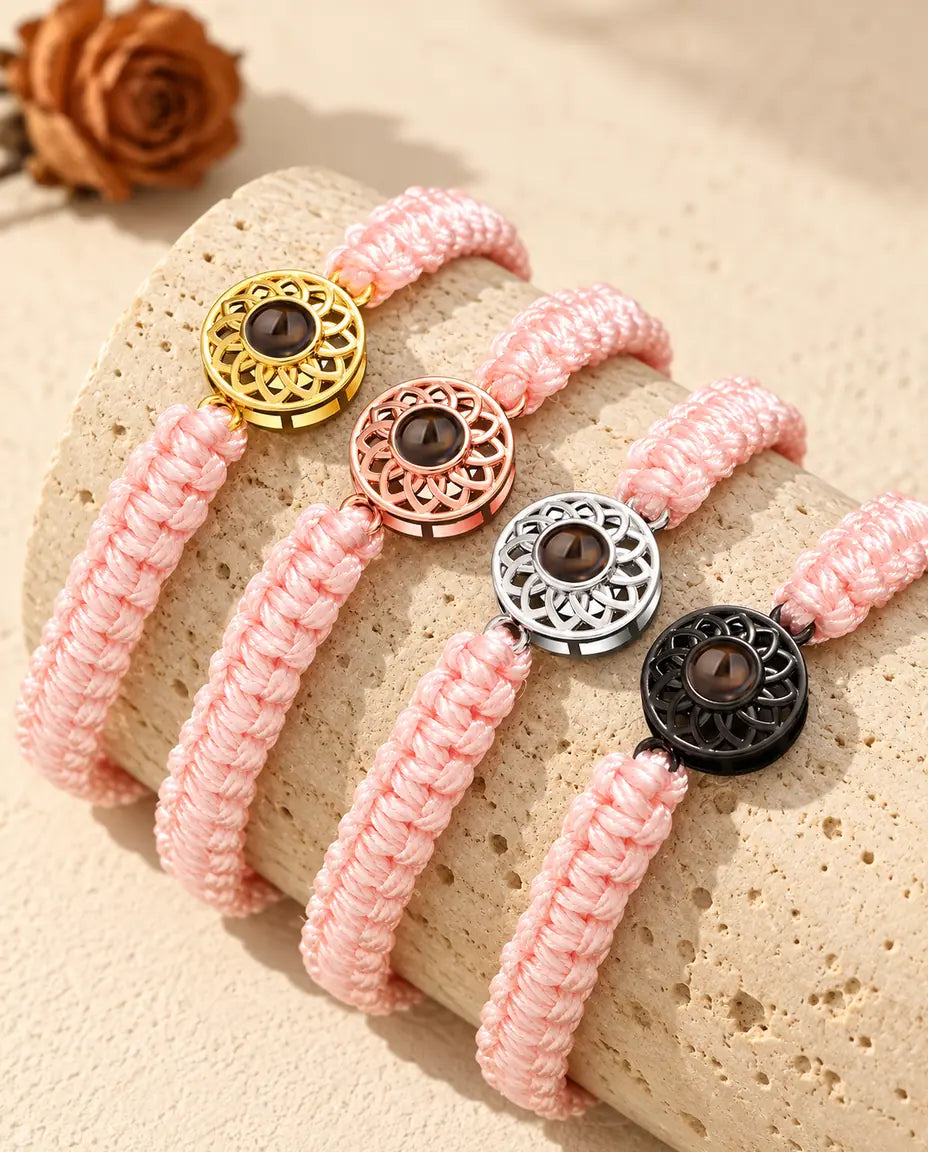 Pink braided cord projection bracelets with gold tone, rose gold tone, silver tone and black round charms
