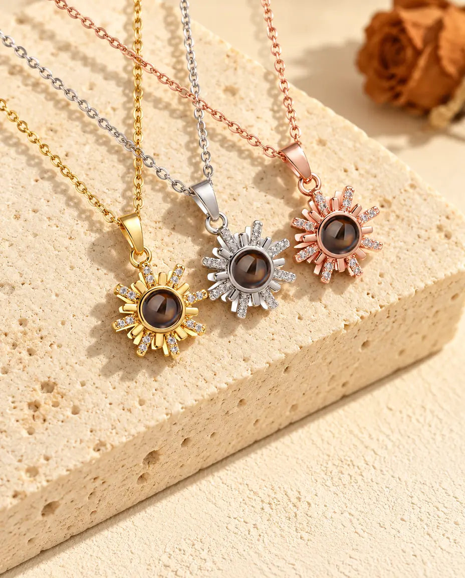 Gold tone, silver tone and rose gold tone sun pendants side by side