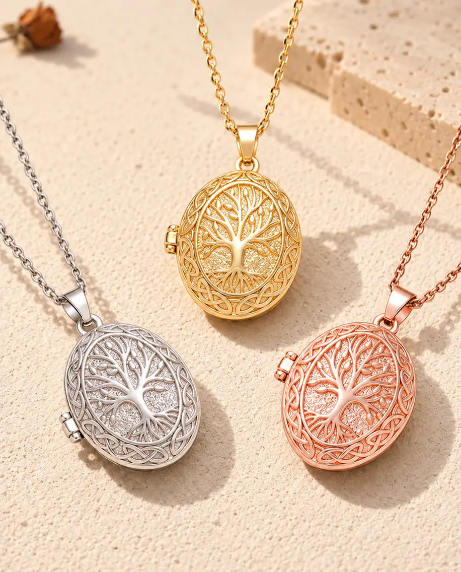 Three colours of the tree of life photo locket necklace arranged on plaster