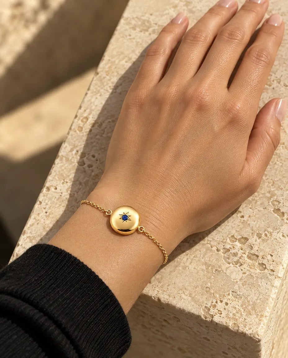 Close view of the round photo locket bracelet on the wrist