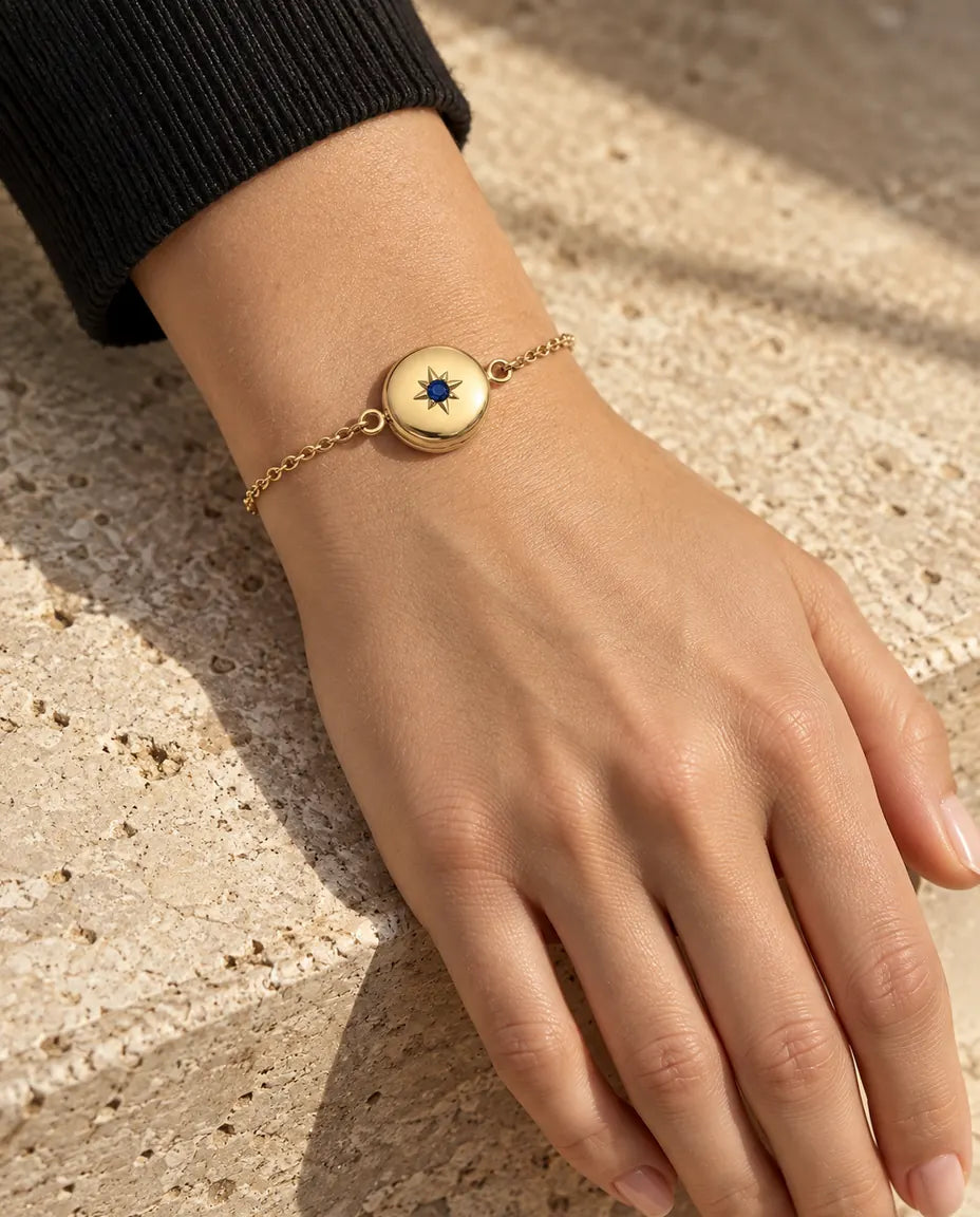 Woman wearing the closed round photo locket bracelet